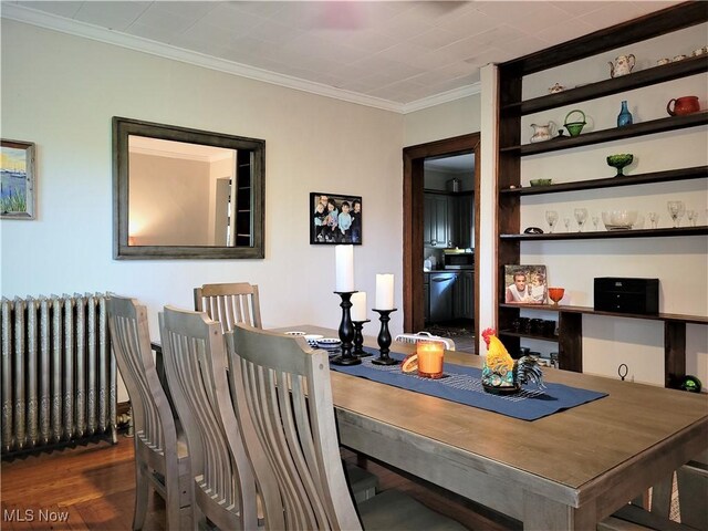 517 N 10th St, Cambridge, OH 43725 - dining room with radiator, ornamental molding, and wood finished floors