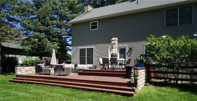 5472 Wixford Ln, Mentor, OH 44060 - back of house with a deck, a chimney, and an outdoor hangout area