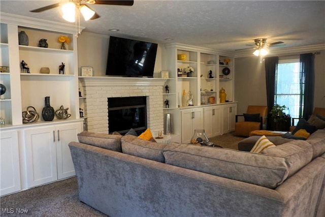 5472 Wixford Ln, Mentor, OH 44060 - living room with ceiling fan, dark carpet, a brick fireplace, crown molding, and built in shelves