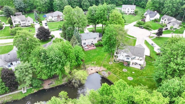 5472 Wixford Ln, Mentor, OH 44060 - aerial view of residential area featuring a nearby body of water and a tree filled landscape