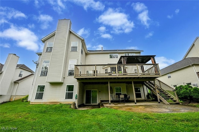 4474 Litchfield Dr, Copley, OH 44321 - rear view of property with a deck, a lawn, a chimney, and a patio area