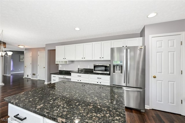 4474 Litchfield Dr, Copley, OH 44321 - kitchen featuring stainless steel appliances, dark wood-style floors, white cabinets, a textured ceiling, and recessed lighting