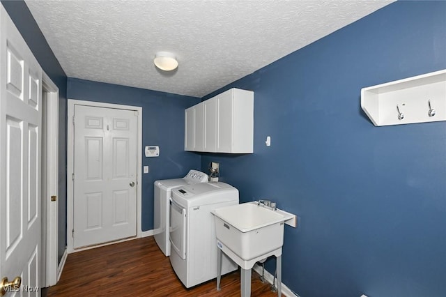 4474 Litchfield Dr, Copley, OH 44321 - washroom with cabinet space, washer and clothes dryer, dark wood-type flooring, baseboards, and a textured ceiling