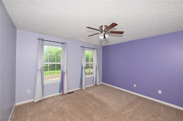 4474 Litchfield Dr, Copley, OH 44321 - carpeted spare room with ceiling fan, a textured ceiling, and baseboards