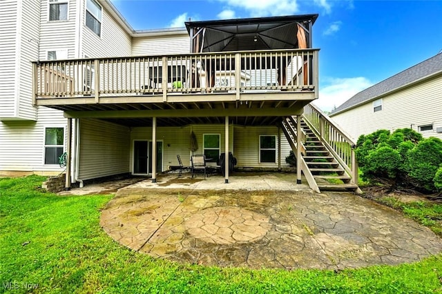 4474 Litchfield Dr, Copley, OH 44321 - back of house featuring a deck, a patio, stairway, and a yard