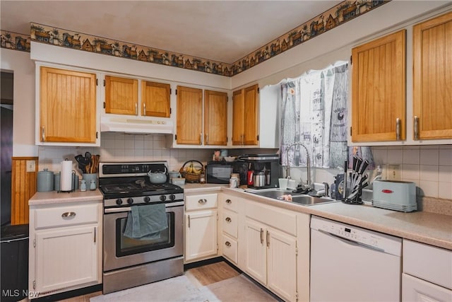 55 Lanham Ln, Davisville, WV 26142 - kitchen with stainless steel gas range oven, under cabinet range hood, white dishwasher, a sink, and light countertops