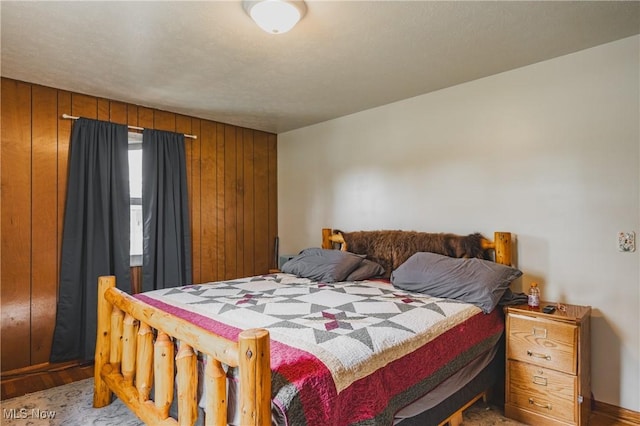 55 Lanham Ln, Davisville, WV 26142 - bedroom featuring wood walls and baseboards
