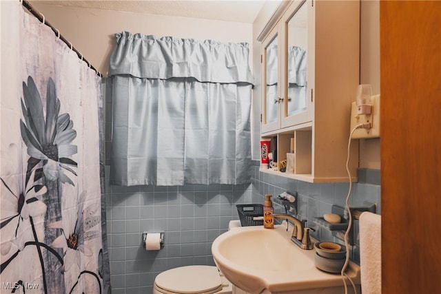 55 Lanham Ln, Davisville, WV 26142 - full bath with toilet, tasteful backsplash, tile walls, a sink, and curtained shower
