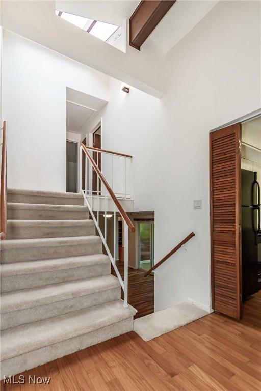 12562 Harold Dr, Chesterland, OH 44026 - stairs featuring attic access and wood finished floors