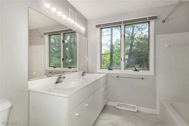 12562 Harold Dr, Chesterland, OH 44026 - full bathroom featuring marble finish floors, a tub to relax in, double vanity, a shower, and toilet