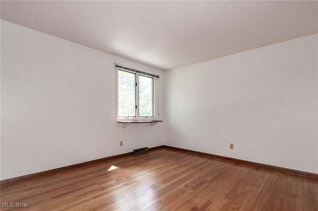 12562 Harold Dr, Chesterland, OH 44026 - spare room featuring light wood-style flooring and baseboards