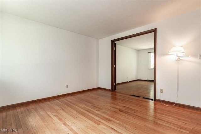 12562 Harold Dr, Chesterland, OH 44026 - unfurnished room with light wood-style floors and baseboards