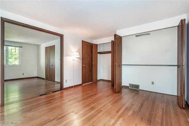 12562 Harold Dr, Chesterland, OH 44026 - unfurnished bedroom featuring light wood-style floors and baseboards