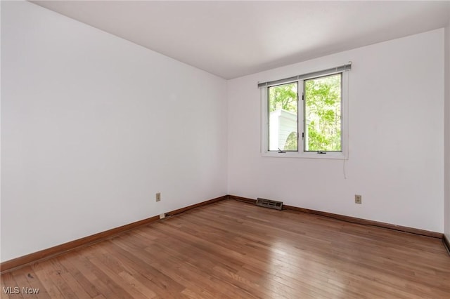 12562 Harold Dr, Chesterland, OH 44026 - empty room with baseboards and light wood finished floors