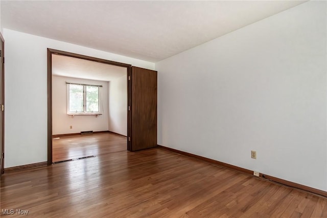 12562 Harold Dr, Chesterland, OH 44026 - unfurnished room with light wood-style flooring and baseboards