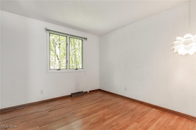 12562 Harold Dr, Chesterland, OH 44026 - empty room featuring light wood finished floors and baseboards