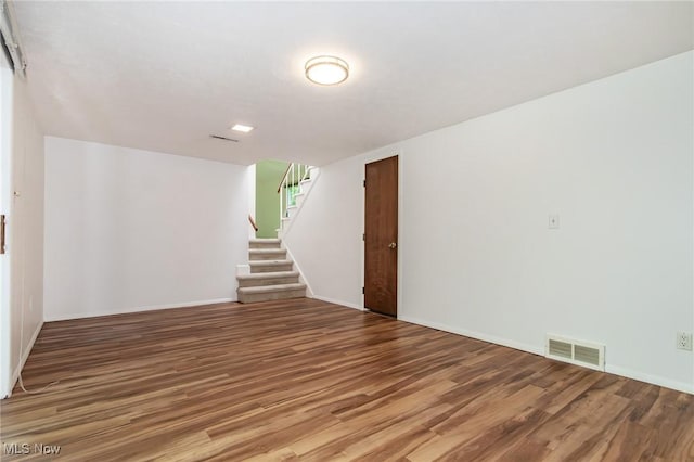 12562 Harold Dr, Chesterland, OH 44026 - unfurnished room with wood finished floors, stairway, and baseboards