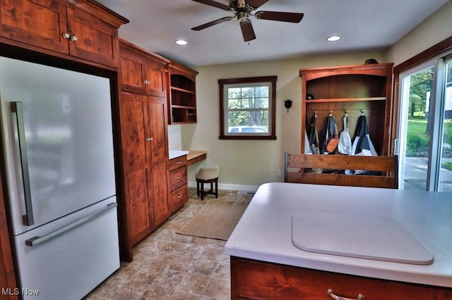 24514 County Road 24, Coshocton, OH 43812 - kitchen with freestanding refrigerator, baseboards, light stone finish floors, open shelves, and a ceiling fan
