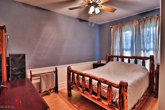 24514 County Road 24, Coshocton, OH 43812 - bedroom featuring wood finished floors and a ceiling fan