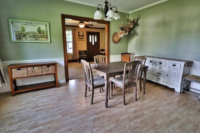 24514 County Road 24, Coshocton, OH 43812 - dining area with ornamental molding, a chandelier, wood finished floors, and ceiling fan
