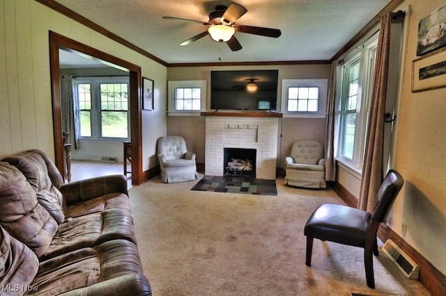 24514 County Road 24, Coshocton, OH 43812 - living area featuring ornamental molding, a brick fireplace, ceiling fan, carpet, and baseboards