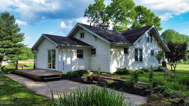 24514 County Road 24, Coshocton, OH 43812 - back of house with a deck, a yard, and a shingled roof