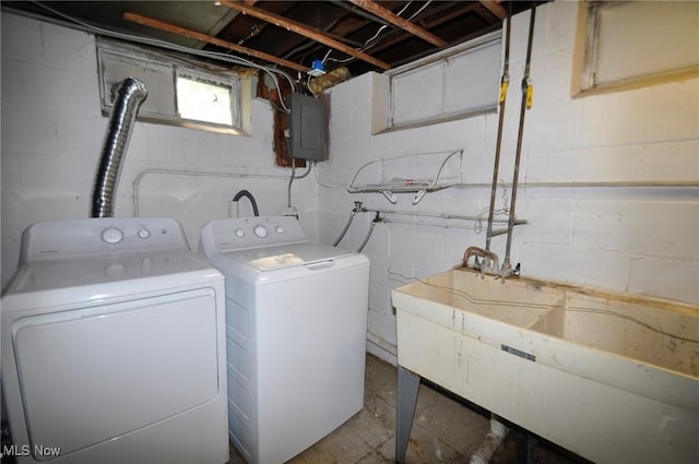 laundry area featuring washing machine and dryer and electric panel