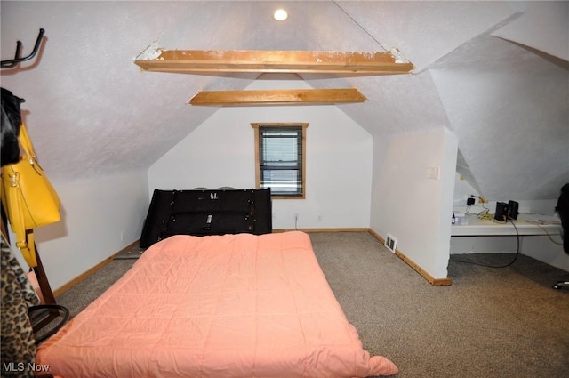 bedroom with vaulted ceiling, carpet flooring, and baseboards