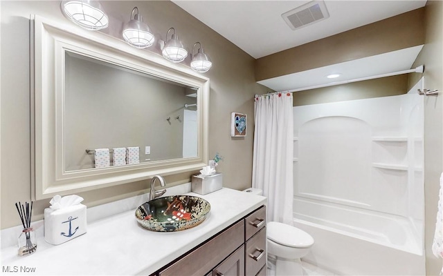 bathroom featuring shower / bathtub combination with curtain, toilet, and vanity