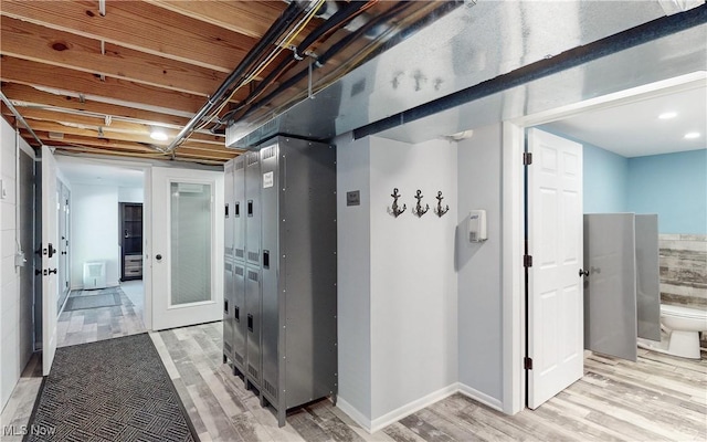 corridor featuring light wood-style floors