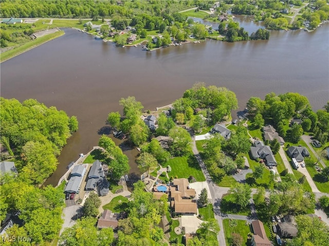 aerial perspective of suburban area with a large body of water