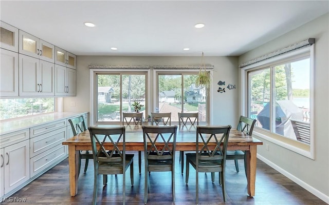 dining space featuring dark wood finished floors, recessed lighting, and baseboards