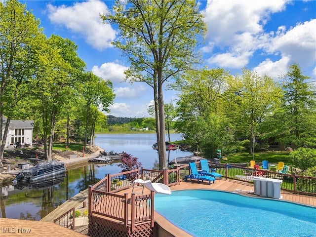 swimming pool with a deck with water view
