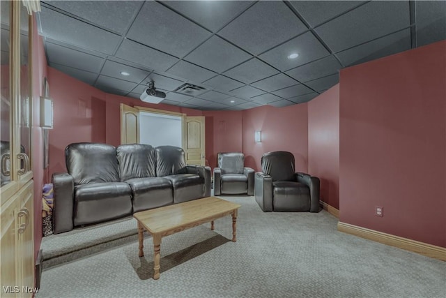 carpeted cinema featuring recessed lighting, baseboards, and a paneled ceiling