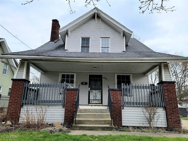 621 Noah Ave, Akron, OH 44320 - bungalow featuring covered porch and a chimney