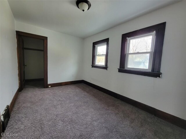 621 Noah Ave, Akron, OH 44320 - unfurnished bedroom with carpet and baseboards