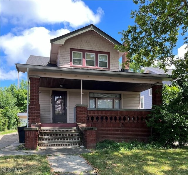 3657 Ludgate Rd, Shaker Heights, OH 44120 - view of front of home featuring a porch and brick siding