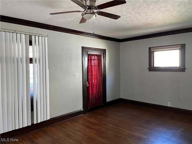 3657 Ludgate Rd, Shaker Heights, OH 44120 - unfurnished room featuring a textured ceiling, dark wood-style flooring, ornamental molding, baseboards, and a ceiling fan