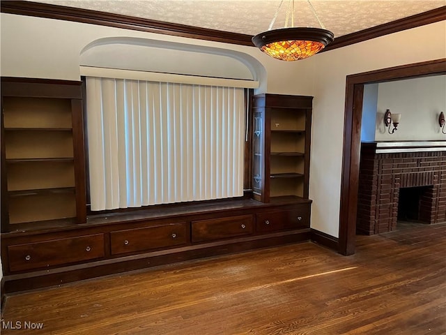 3657 Ludgate Rd, Shaker Heights, OH 44120 - unfurnished living room with wood finished floors, ornamental molding, a brick fireplace, and baseboards