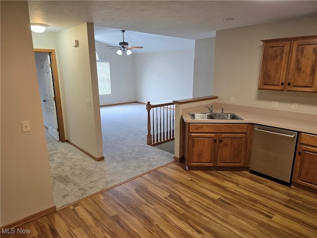 2457 Barrington Way, Wooster, OH 44691 - kitchen with dishwasher, a ceiling fan, a sink, light wood-style flooring, and baseboards