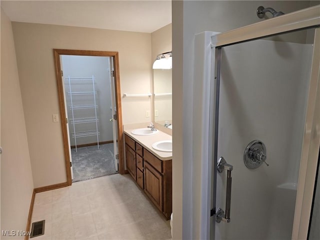 2457 Barrington Way, Wooster, OH 44691 - full bathroom featuring a shower, double vanity, and baseboards