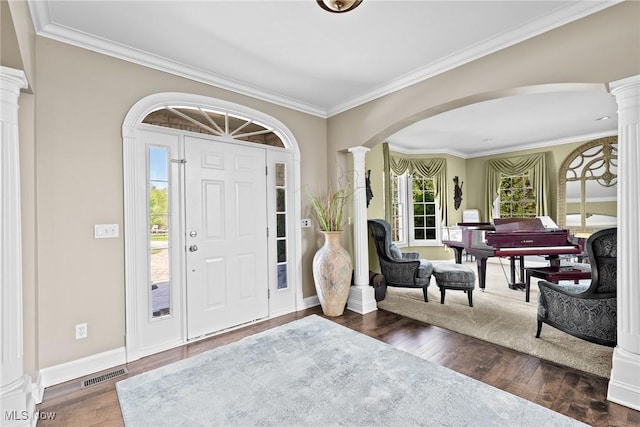915 Creek View Dr, Aurora, OH 44202 - entryway featuring decorative columns, arched walkways, ornamental molding, wood finished floors, and baseboards