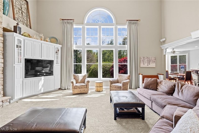 915 Creek View Dr, Aurora, OH 44202 - carpeted living area with a towering ceiling, plenty of natural light, and ceiling fan