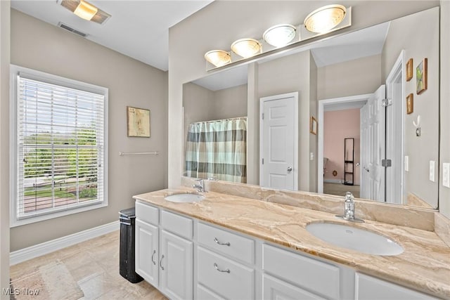 915 Creek View Dr, Aurora, OH 44202 - bathroom featuring baseboards, double vanity, a shower with shower curtain, and tile patterned flooring