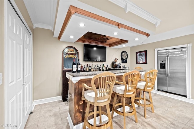 915 Creek View Dr, Aurora, OH 44202 - indoor wet bar with stainless steel fridge with ice dispenser, crown molding, recessed lighting, baseboards, and light tile patterned floors
