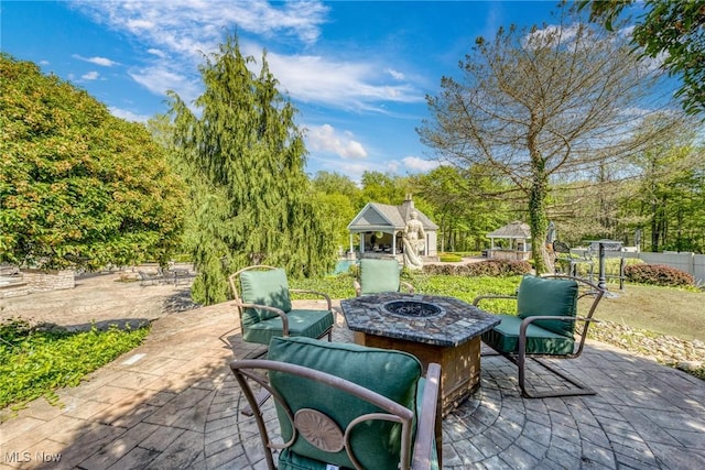 915 Creek View Dr, Aurora, OH 44202 - view of patio featuring an outdoor fire pit and a gazebo