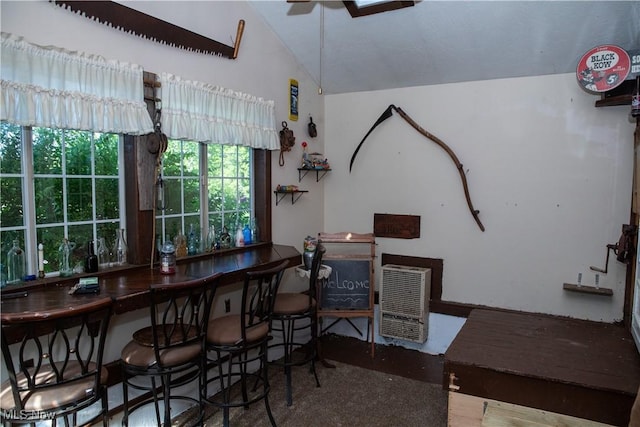 dining room featuring vaulted ceiling and a ceiling fan