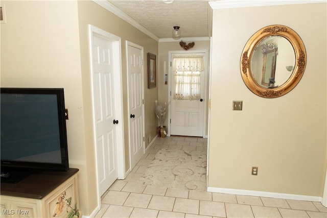 corridor with light tile patterned floors, baseboards, and ornamental molding