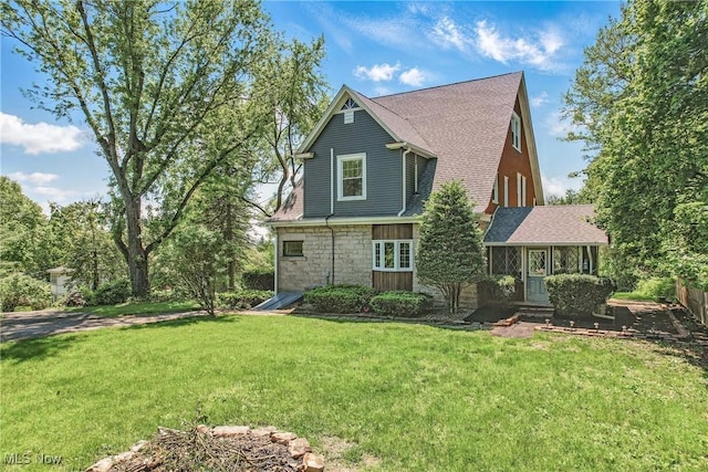 899 Park Blvd W, East Liverpool, OH 43920 - back of property featuring a lawn, stone siding, and roof with shingles