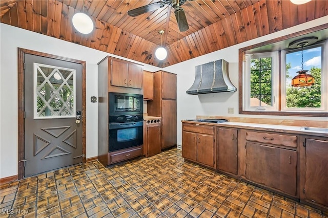 899 Park Blvd W, East Liverpool, OH 43920 - kitchen with black appliances, wall chimney range hood, light countertops, baseboards, and a ceiling fan